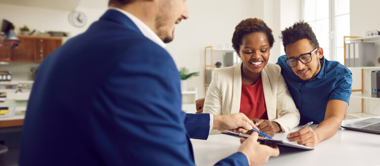 couple signing loan document