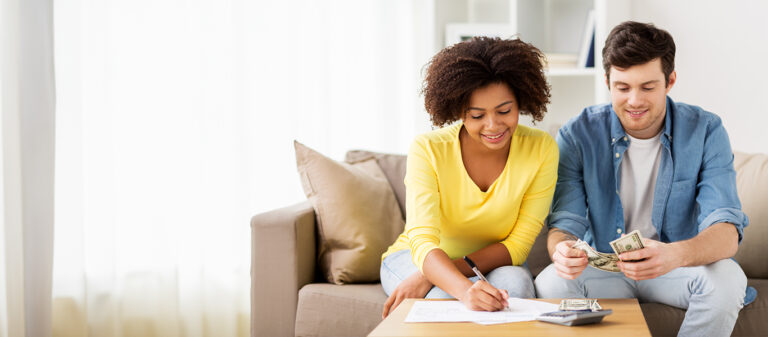 Young couple looking at investments together