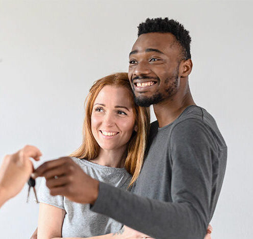 couple getting keys to new house